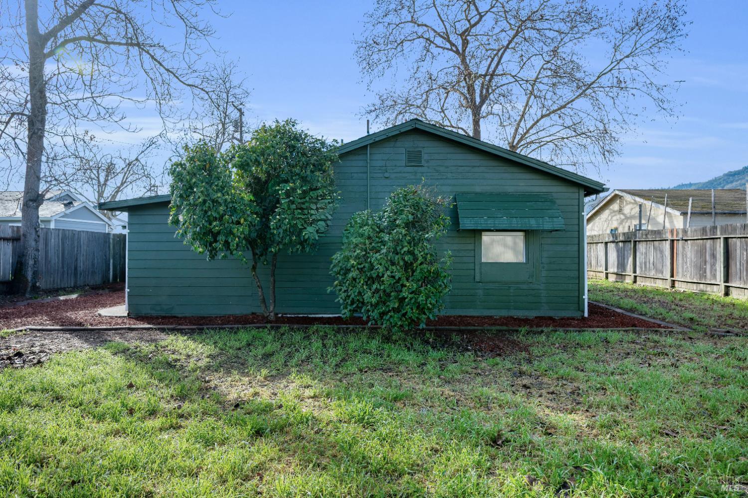 160 Thomas Street Ukiah, CA 95482 - Photo 21 of 26 a view of a house with a small yard and wooden fence