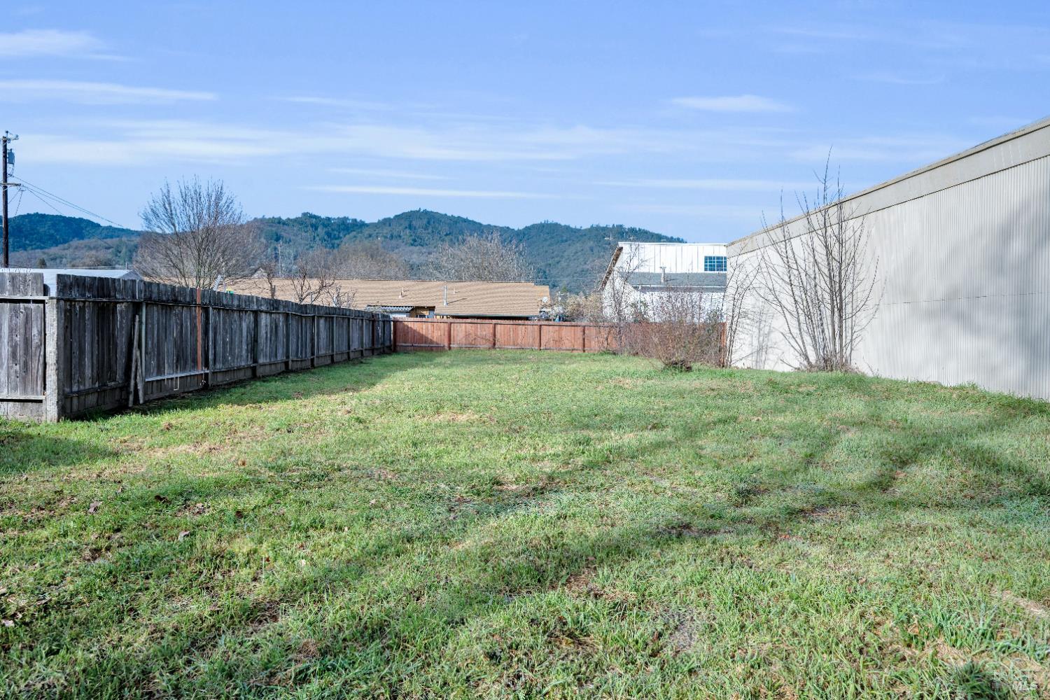 160 Thomas Street Ukiah, CA 95482 - Photo 24 of 26 a view of a yard with a house in the background