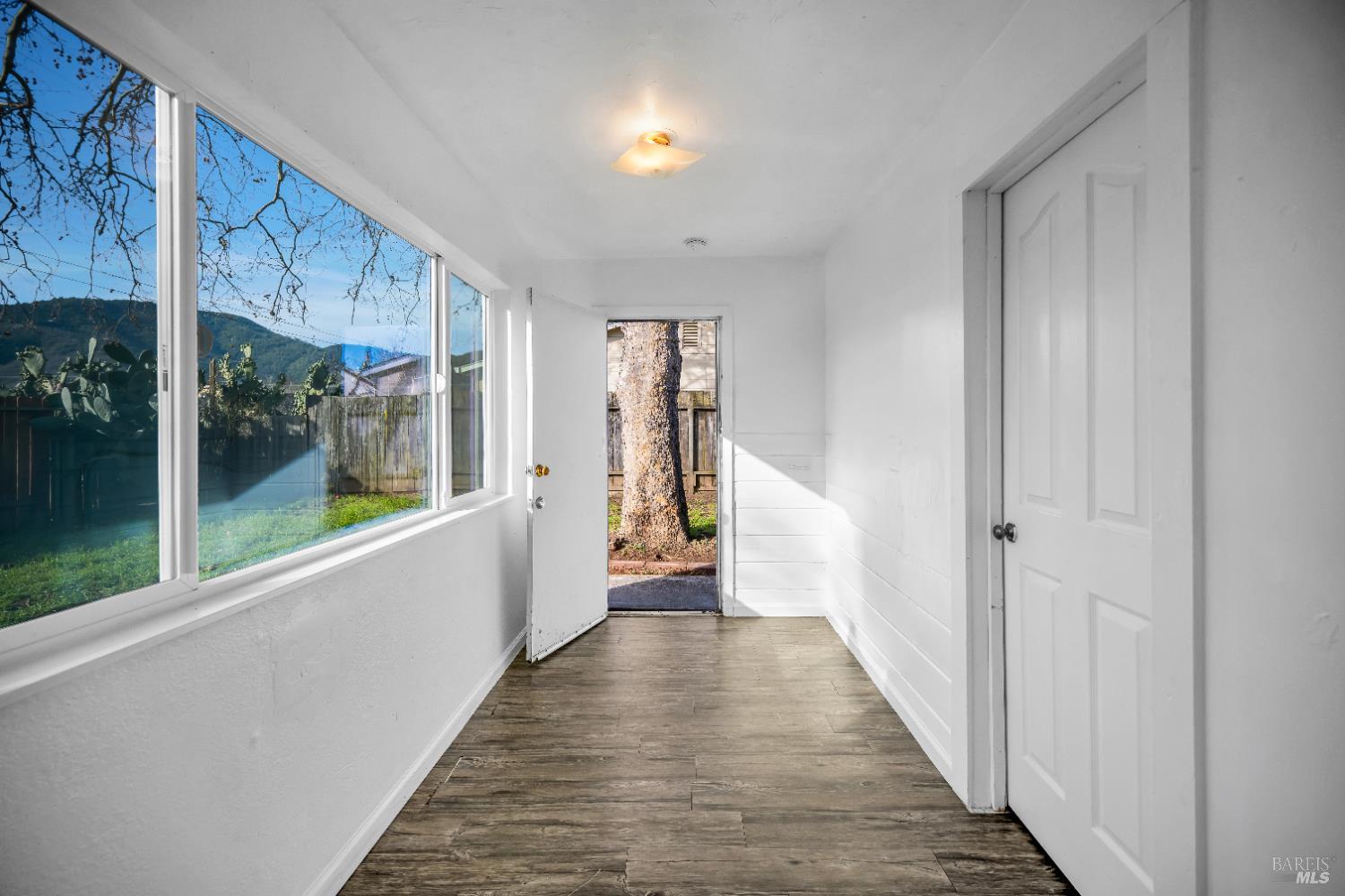 160 Thomas Street Ukiah, CA 95482 - Photo 5 of 26 a view of a hallway with wooden floor and windows
