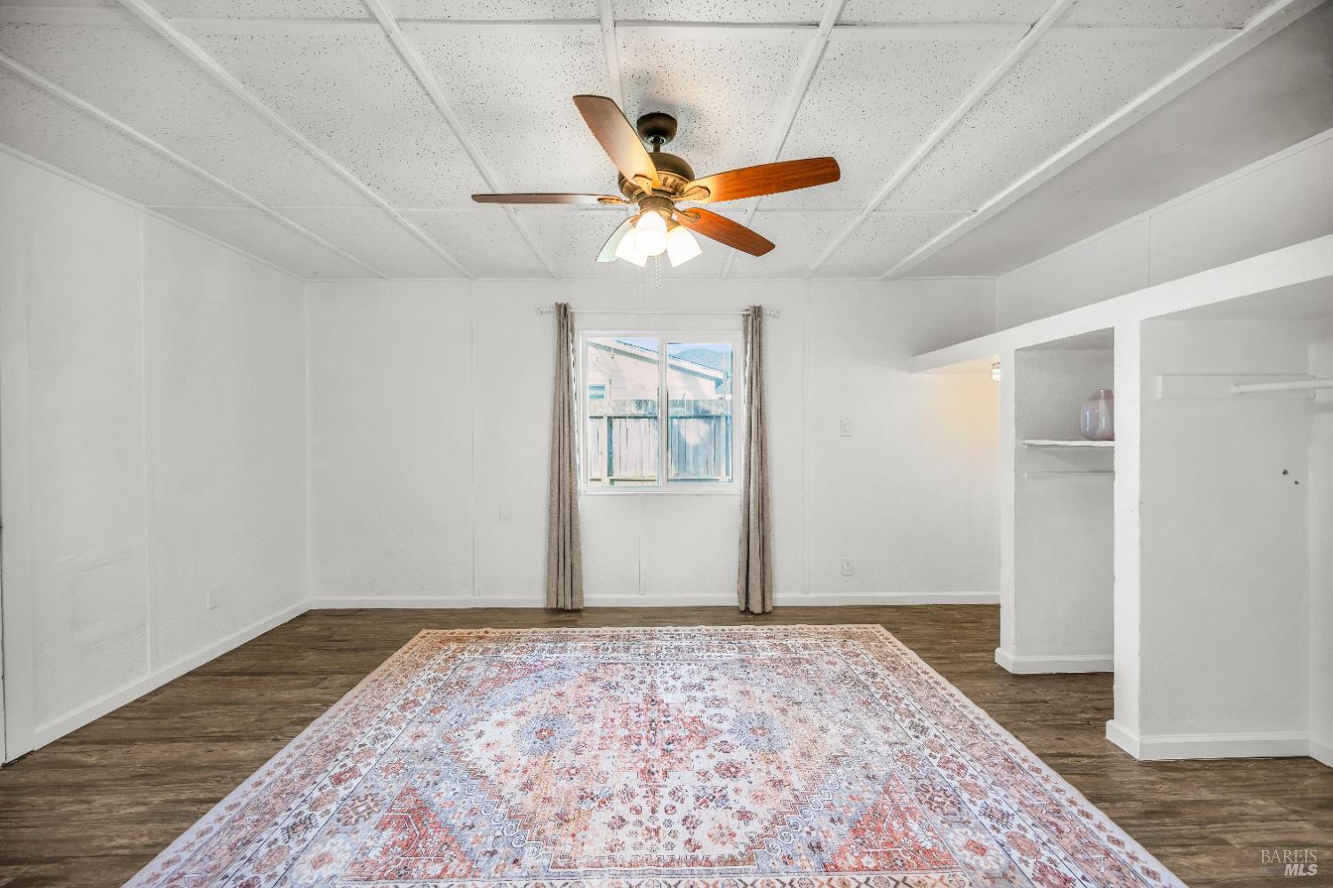 160 Thomas Street Ukiah, CA 95482 - Photo 7 of 26 a view of a livingroom with a ceiling fan and wooden floor