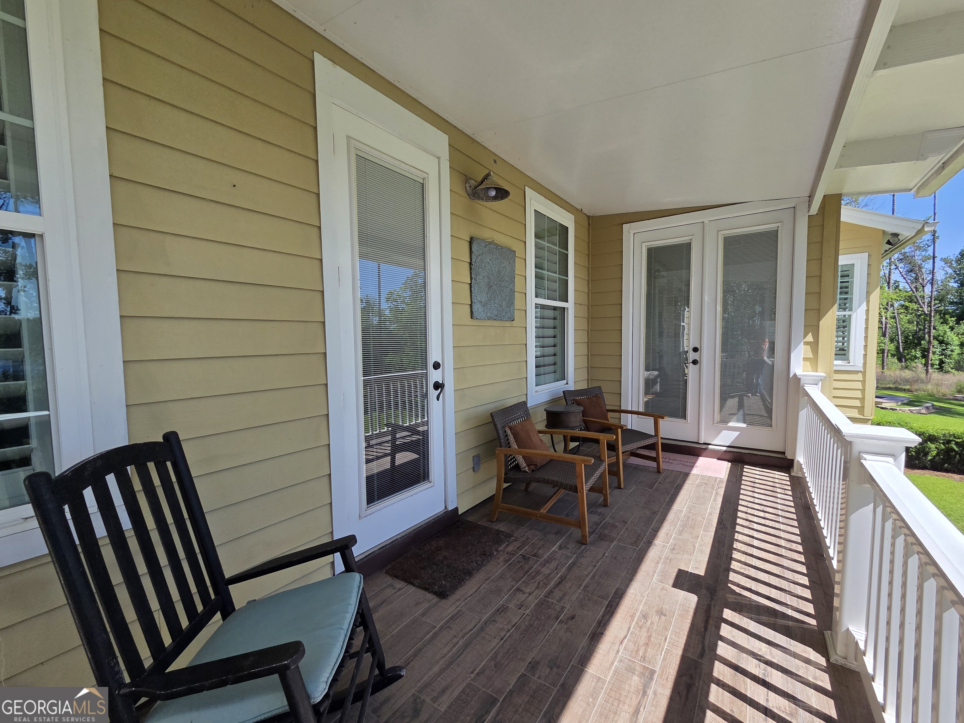 300 Hammond Powell Road Hazlehurst, GA 31539 - Photo 66 of 91 a balcony with chairs and wooden floor