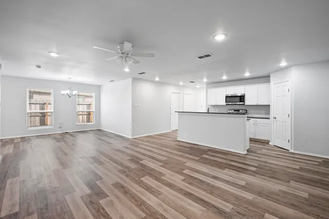 a view of kitchen with wooden floor and window
