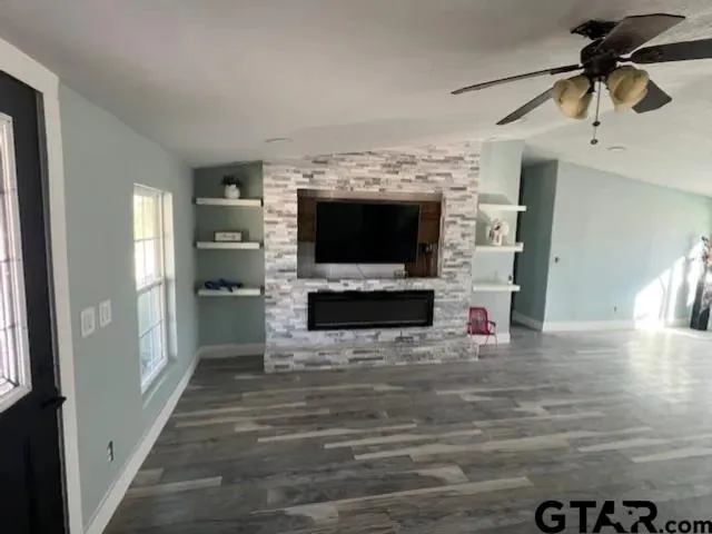 a view of living room with furniture and flat screen tv