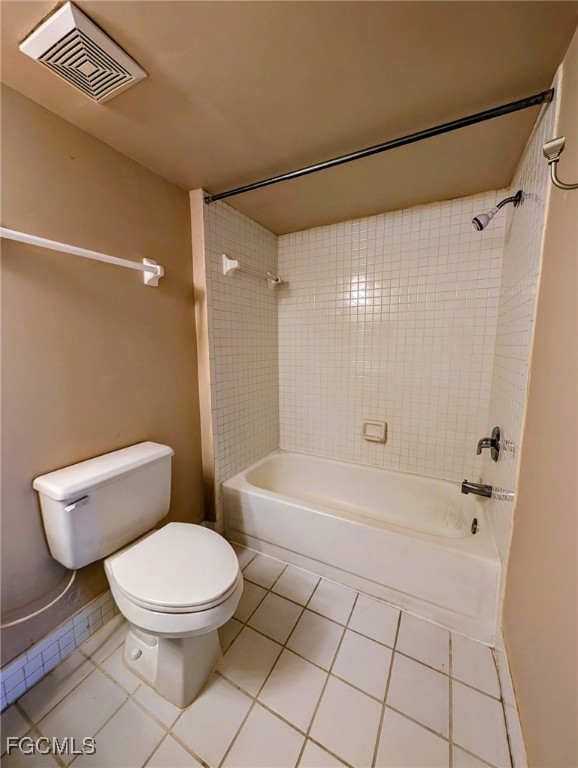 3407 Winkler Avenue, Unit 319 Fort Myers, FL 33916 - Photo 16 of 18 a white toilet sitting next to a bath tub and a shower