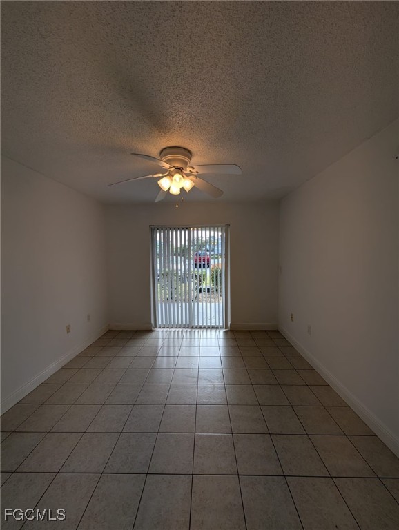 3407 Winkler Avenue, Unit 319 Fort Myers, FL 33916 - Photo 8 of 18 wooden floor in an empty room with a window