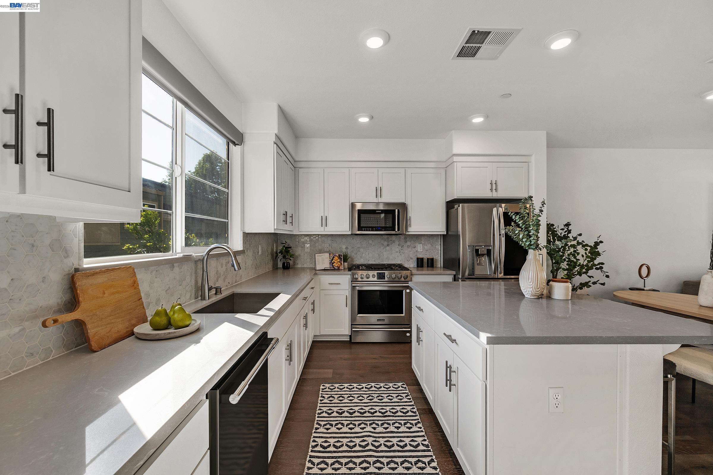 29259 Hub Court Hayward, CA 94544 - Photo 7 of 34 a kitchen with stainless steel appliances a stove a sink a microwave a refrigerator and cabinets