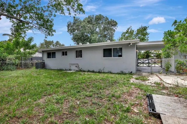 a backyard of a house with lots of green space