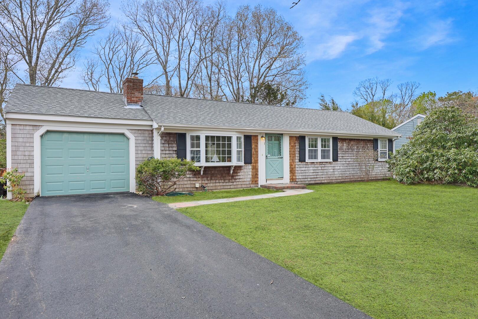 7 Jonquil Road Yarmouth Port, MA 02675 - Photo 1 of 16 a front view of a house with garden