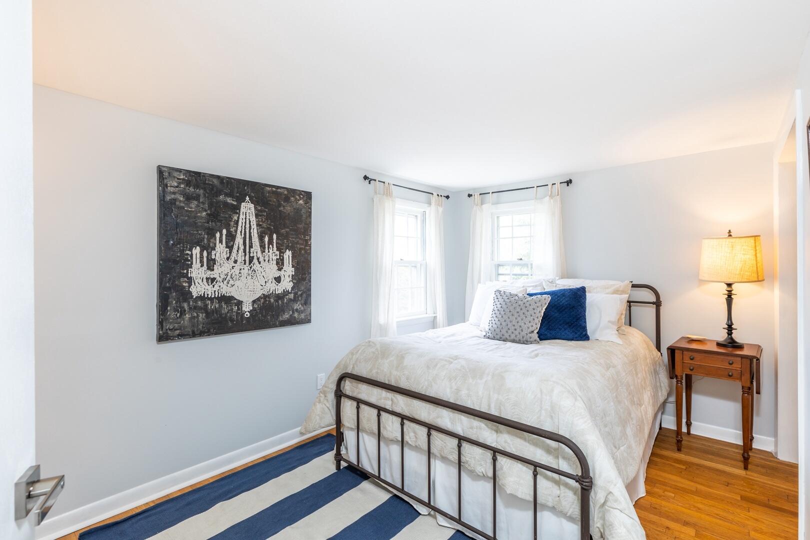 7 Jonquil Road Yarmouth Port, MA 02675 - Photo 13 of 16 a bedroom with a bed and a lamp on table