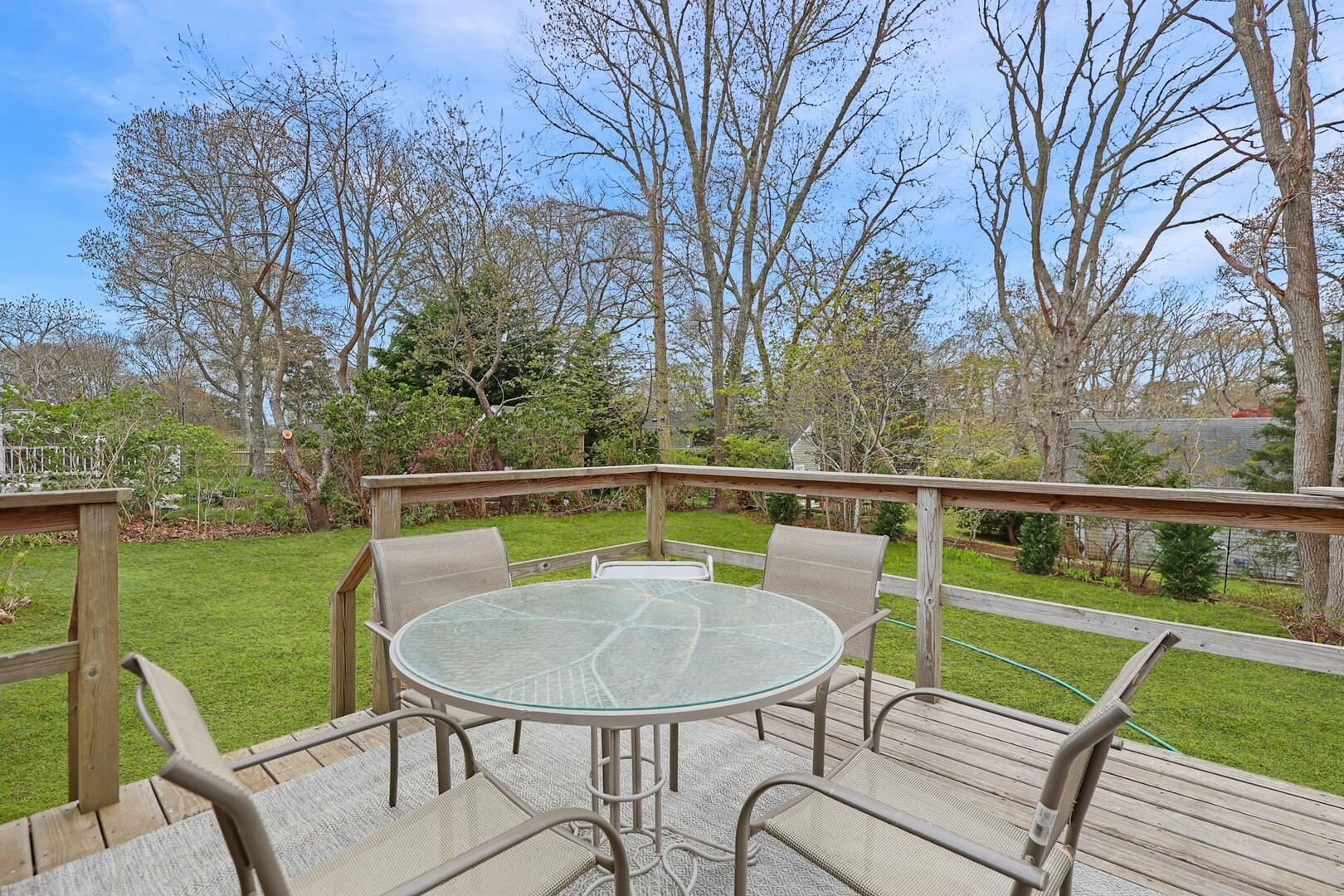 7 Jonquil Road Yarmouth Port, MA 02675 - Photo 16 of 16 a view of a chairs and table on the deck