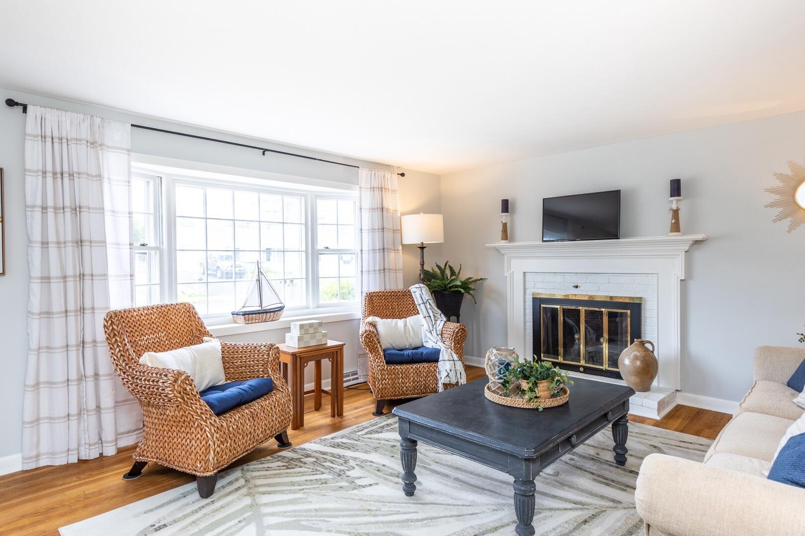7 Jonquil Road Yarmouth Port, MA 02675 - Photo 3 of 16 a living room with furniture a fireplace and a large window