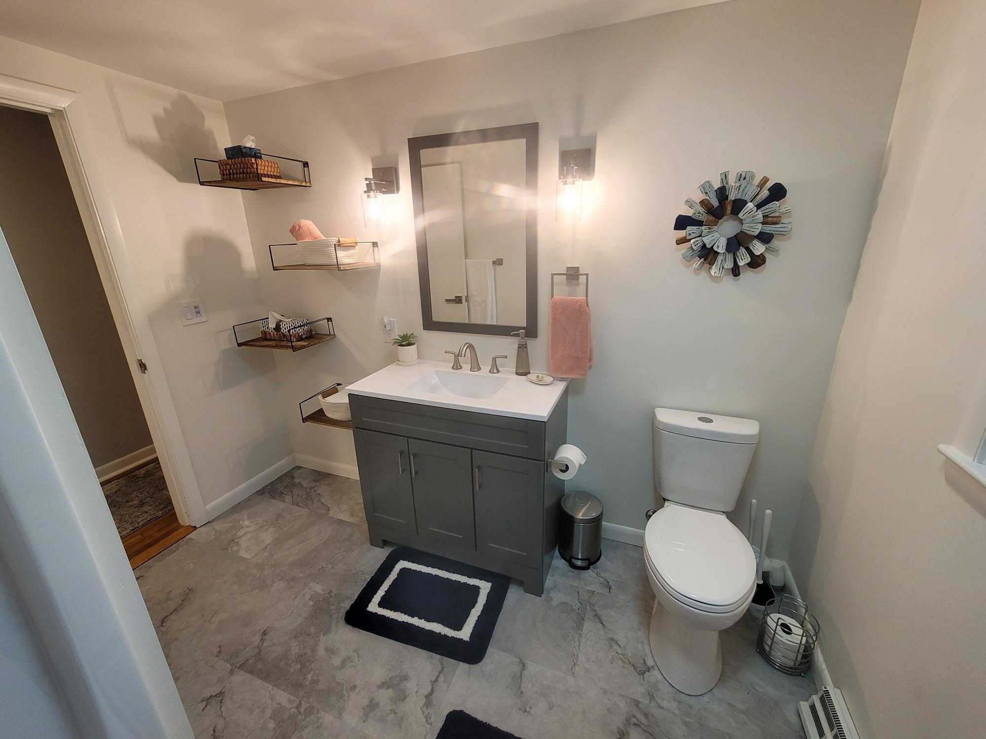 7 Jonquil Road Yarmouth Port, MA 02675 - Photo 9 of 16 a bathroom with a toilet sink and mirror