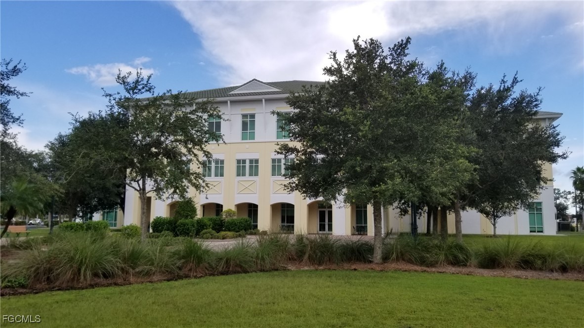 1147203405 Whaling Road North Port, FL 34288 - Photo 5 of 41 a front view of a house with a garden