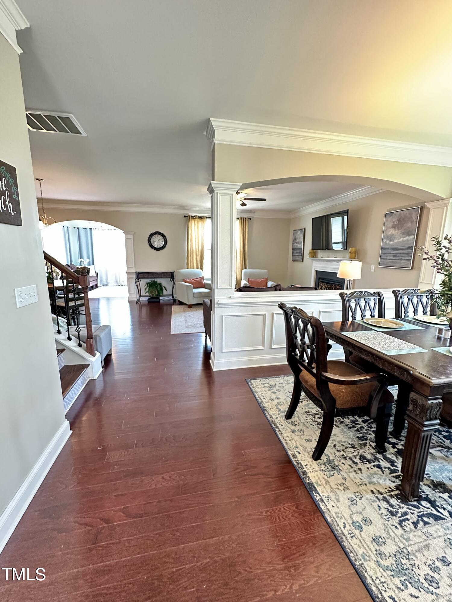 8305 Pin Cherry Drive Willow Spring, NC 27592 - Photo 12 of 60 a living room with furniture and a wooden floor