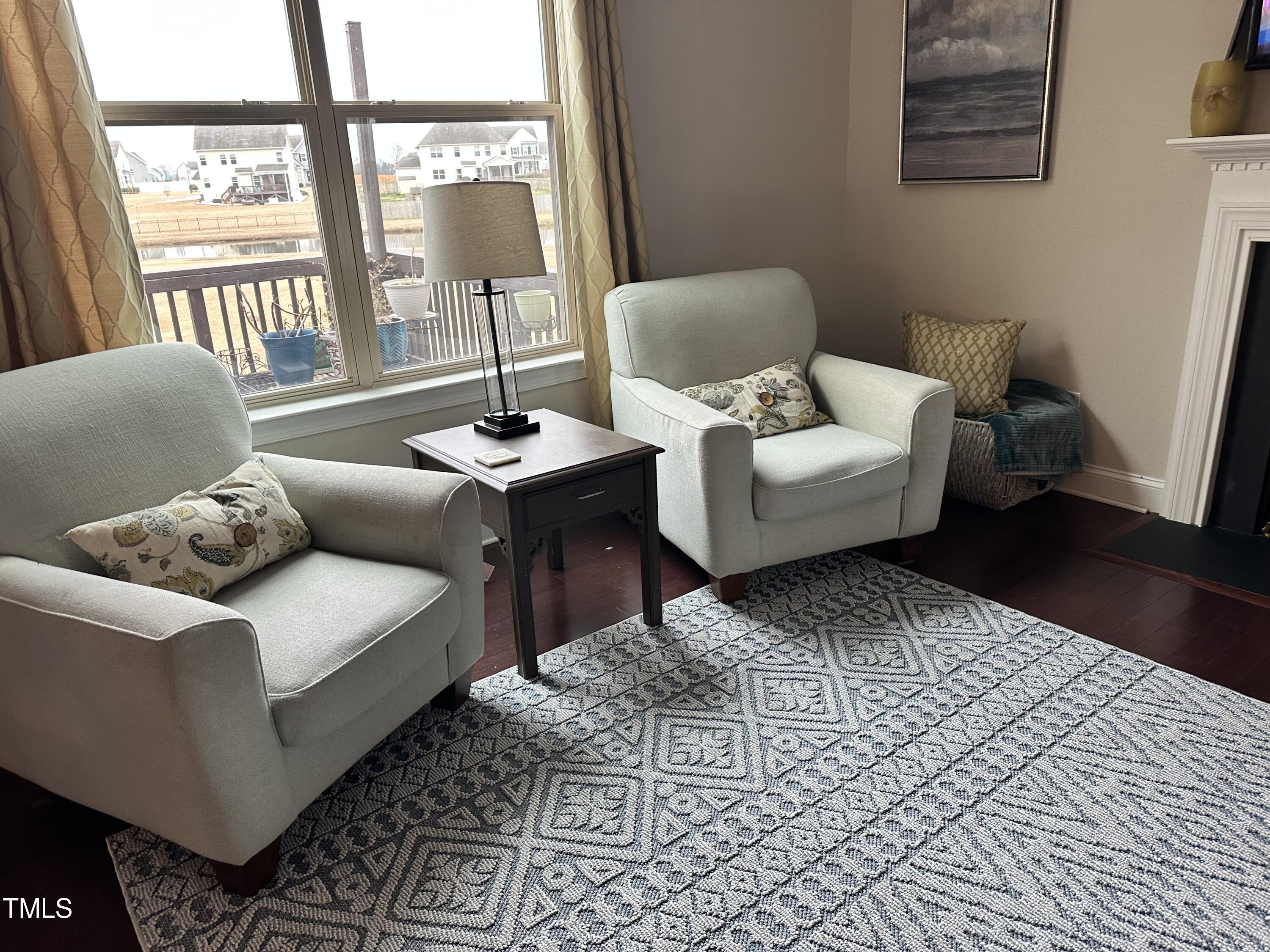 8305 Pin Cherry Drive Willow Spring, NC 27592 - Photo 14 of 60 a living room with furniture and a window