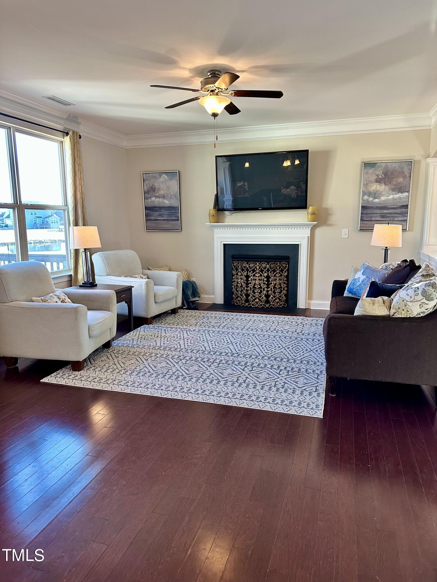 8305 Pin Cherry Drive Willow Spring, NC 27592 - Photo 16 of 60 a living room with furniture and a fireplace