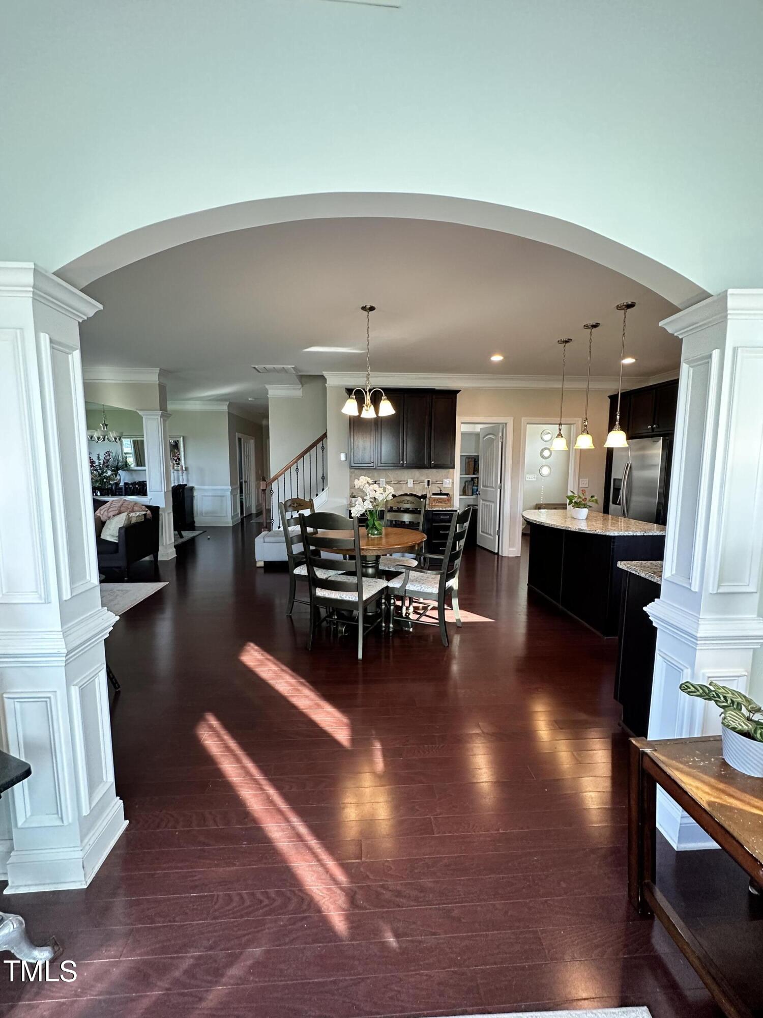 8305 Pin Cherry Drive Willow Spring, NC 27592 - Photo 19 of 60 a living room with furniture and kitchen view