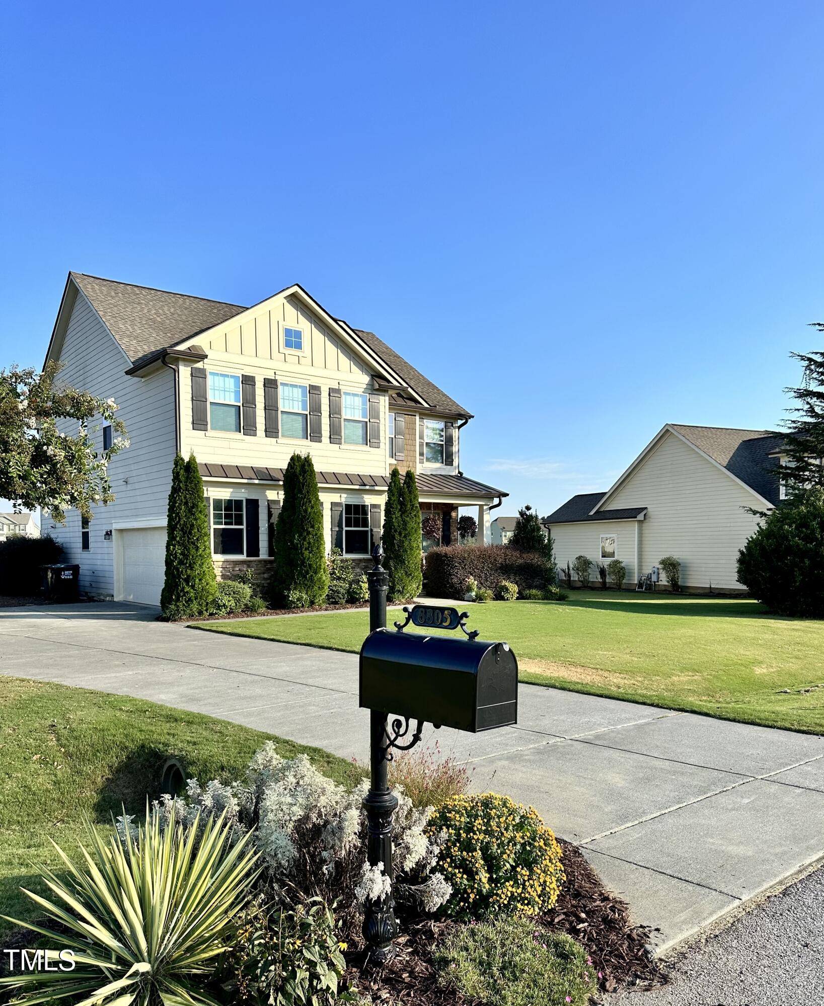 8305 Pin Cherry Drive Willow Spring, NC 27592 - Photo 2 of 60 a front view of a house with a yard
