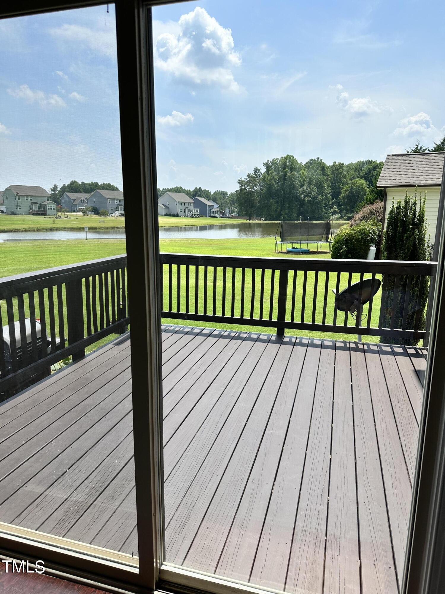 8305 Pin Cherry Drive Willow Spring, NC 27592 - Photo 21 of 60 a view of balcony with wooden floor and fence