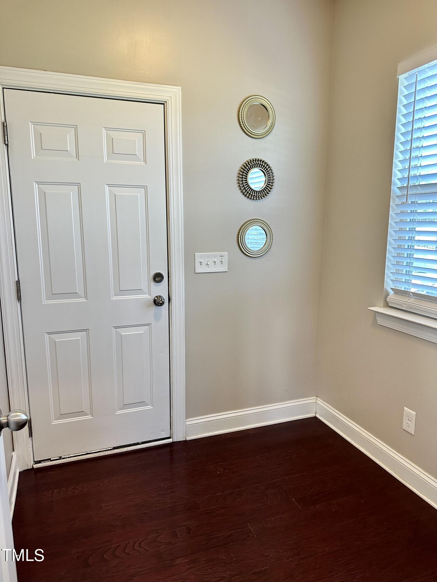 8305 Pin Cherry Drive Willow Spring, NC 27592 - Photo 26 of 60 an empty room with wooden floor and windows