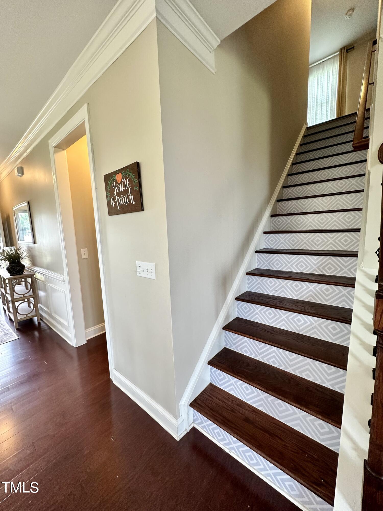 8305 Pin Cherry Drive Willow Spring, NC 27592 - Photo 28 of 60 a view of a hallway with entryway wooden floor and front door