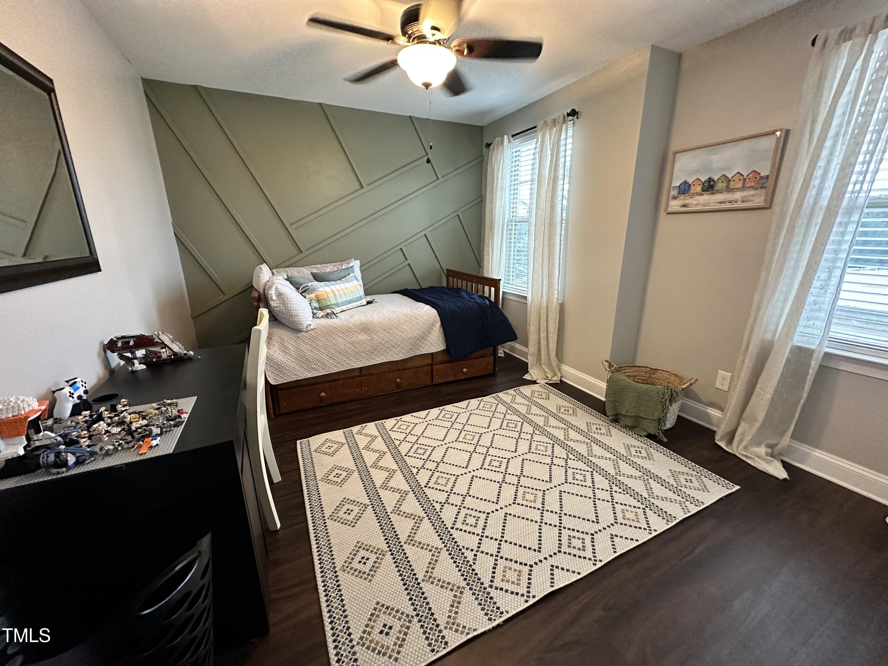 8305 Pin Cherry Drive Willow Spring, NC 27592 - Photo 38 of 60 a bedroom with a bed and a window