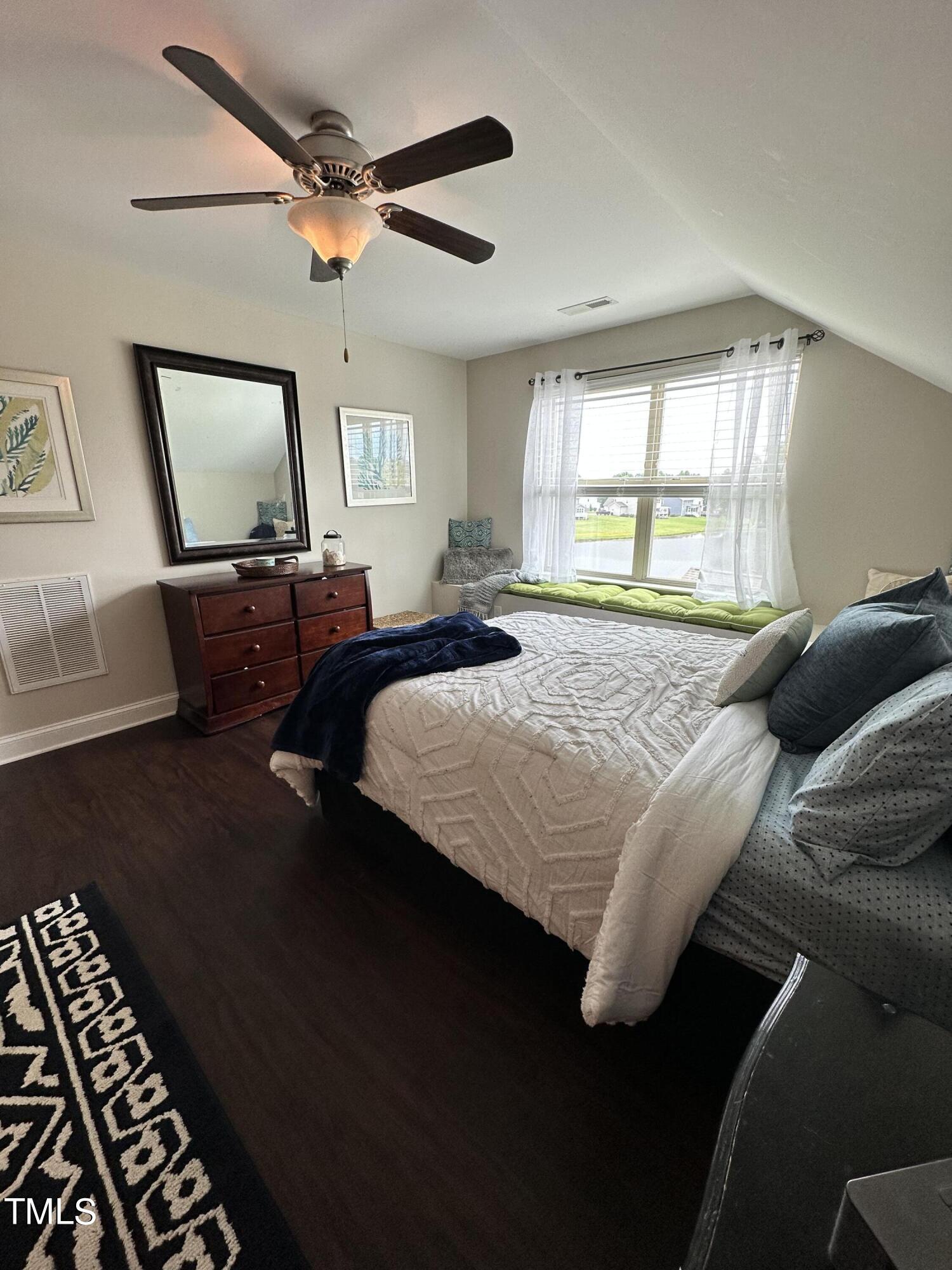 8305 Pin Cherry Drive Willow Spring, NC 27592 - Photo 49 of 60 a bedroom with double bed and a window