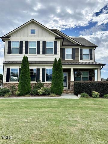 8305 Pin Cherry Drive Willow Spring, NC 27592 - Photo 59 of 60 a front view of a house with a yard
