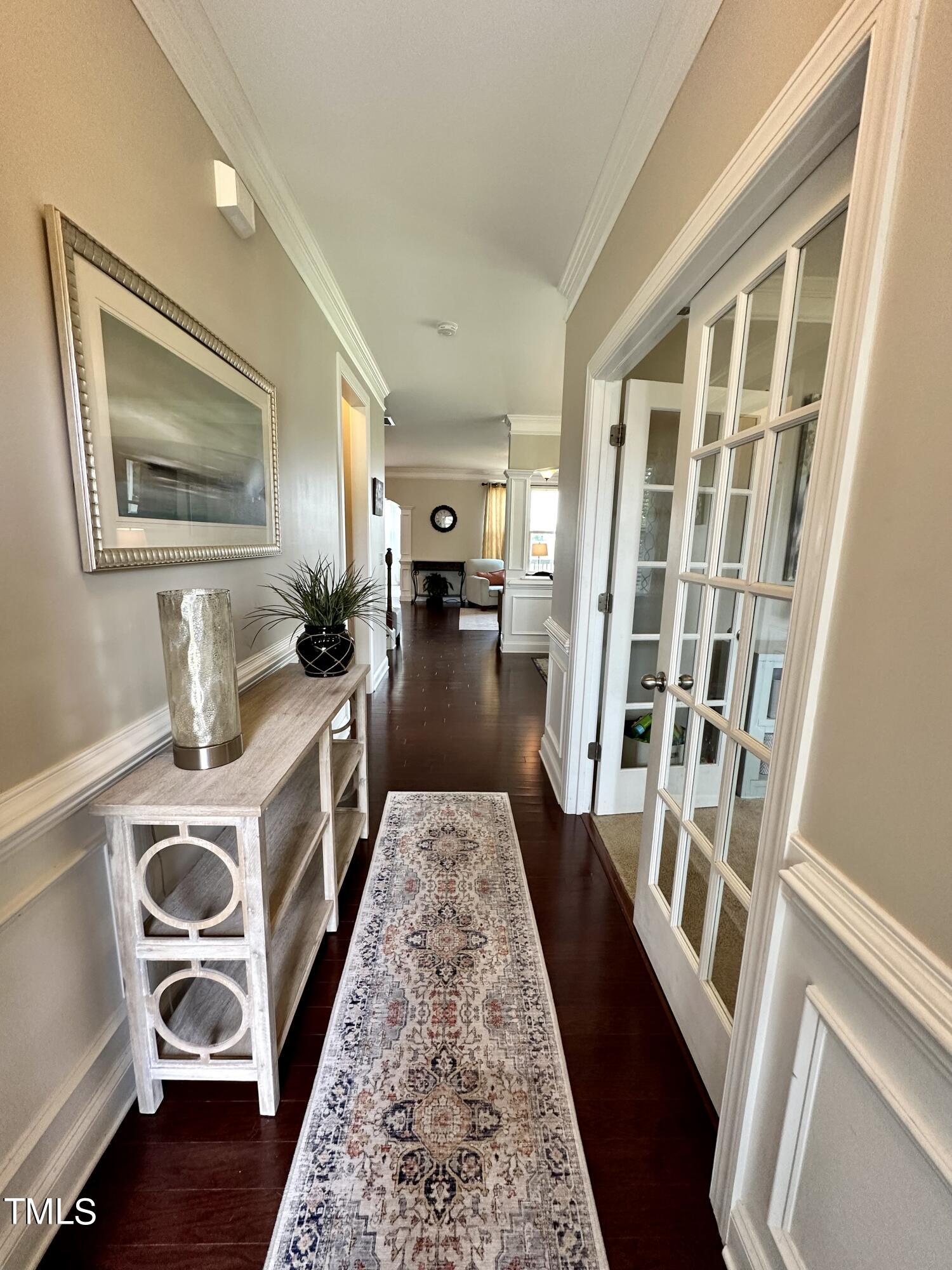 8305 Pin Cherry Drive Willow Spring, NC 27592 - Photo 6 of 60 a view of a kitchen with fridge and wooden floor