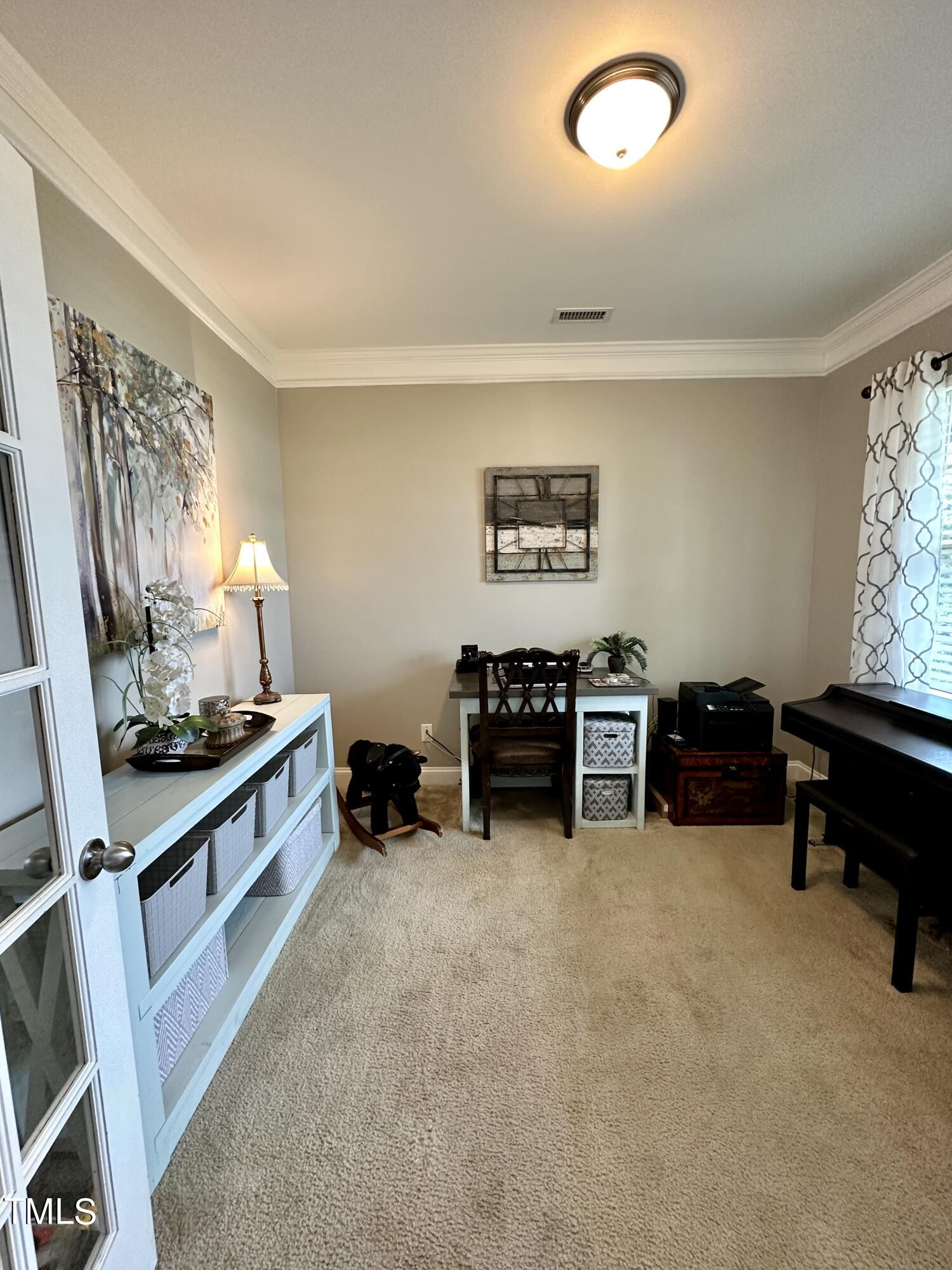 8305 Pin Cherry Drive Willow Spring, NC 27592 - Photo 7 of 60 a kitchen with furniture and a large window