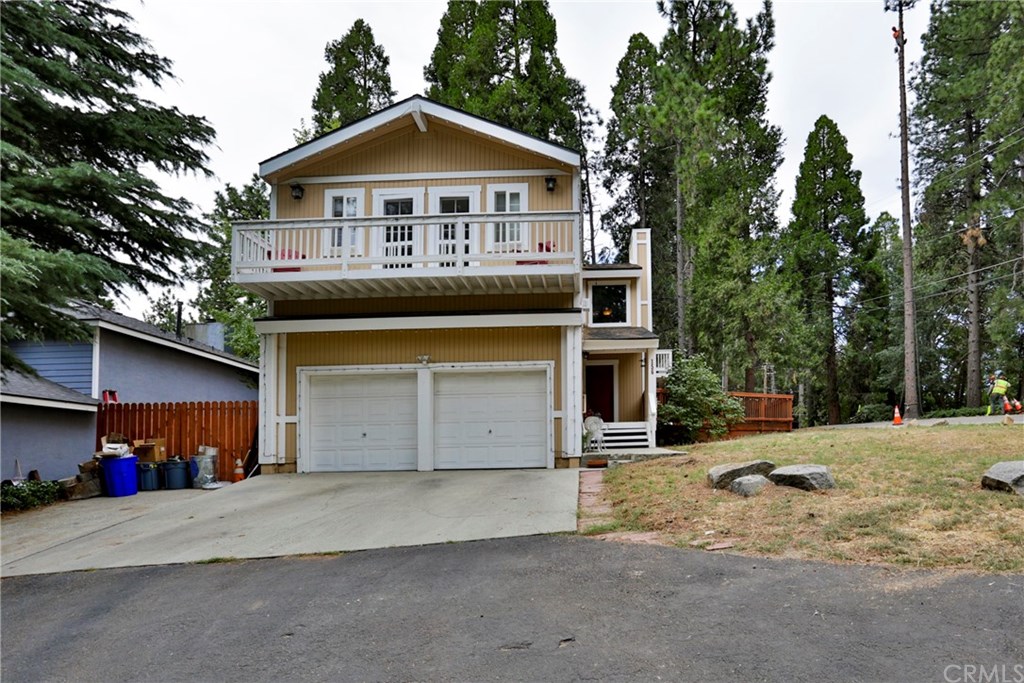 156 Cedar Lane Road Crestline, CA 92325 - Photo 1 of 1 a front view of a house with a yard and garage
