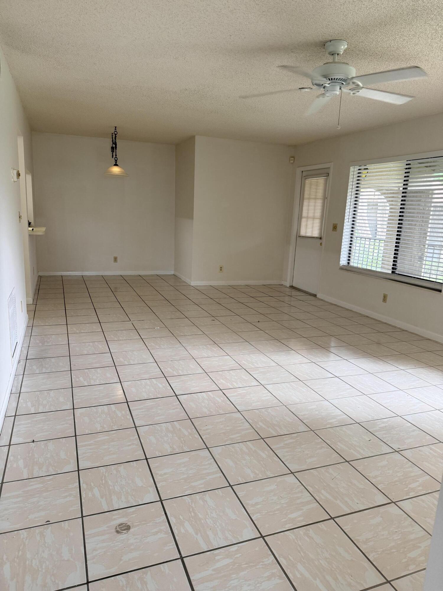 520 Shady Pine Way, Unit C2 Greenacres, FL 33415 - Photo 2 of 10 a view of a livingroom with window