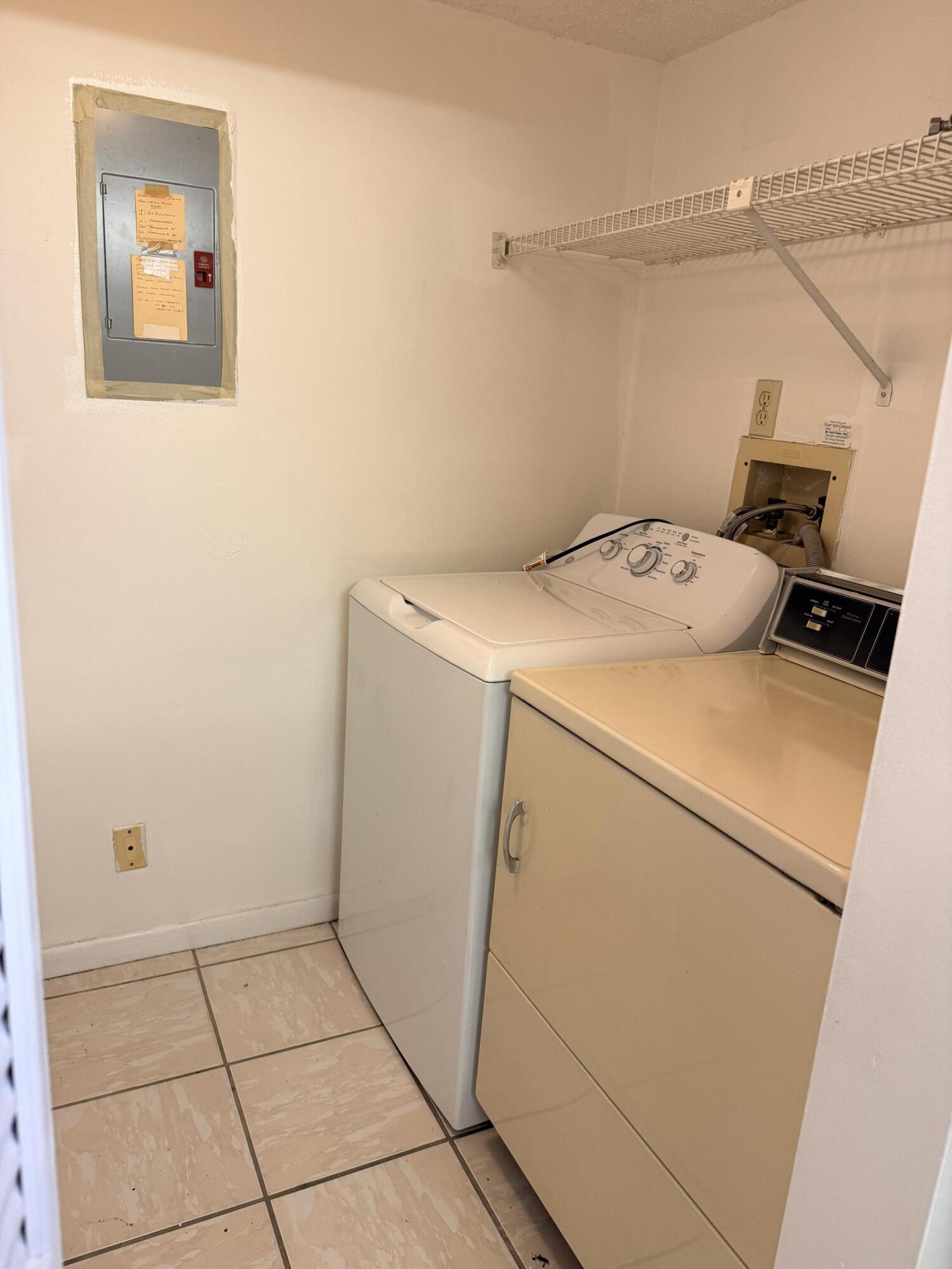 520 Shady Pine Way, Unit C2 Greenacres, FL 33415 - Photo 4 of 10 a utility room with dryer and washer