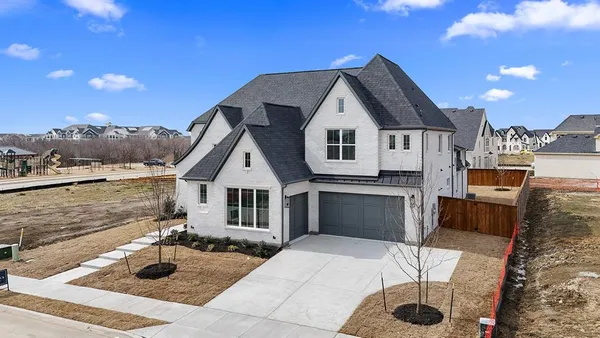 a front view of a house with yard