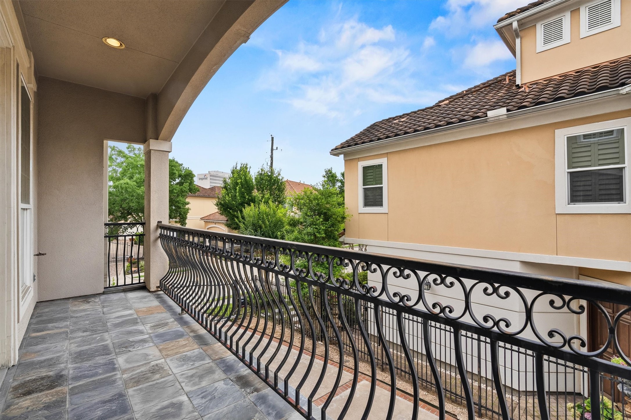 5507 Val Verde Street Houston, TX 77056 - Photo 14 of 42 a view of a balcony with a floor to ceiling window and wooden floor