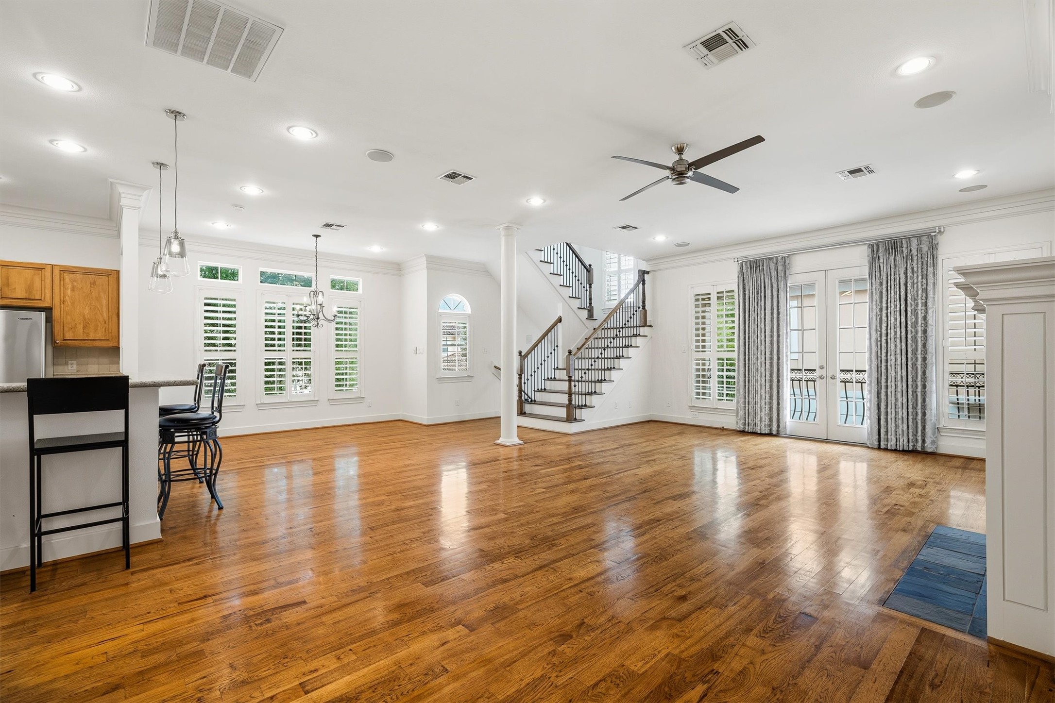5507 Val Verde Street Houston, TX 77056 - Photo 19 of 42 a view of an empty room with wooden floor and a window