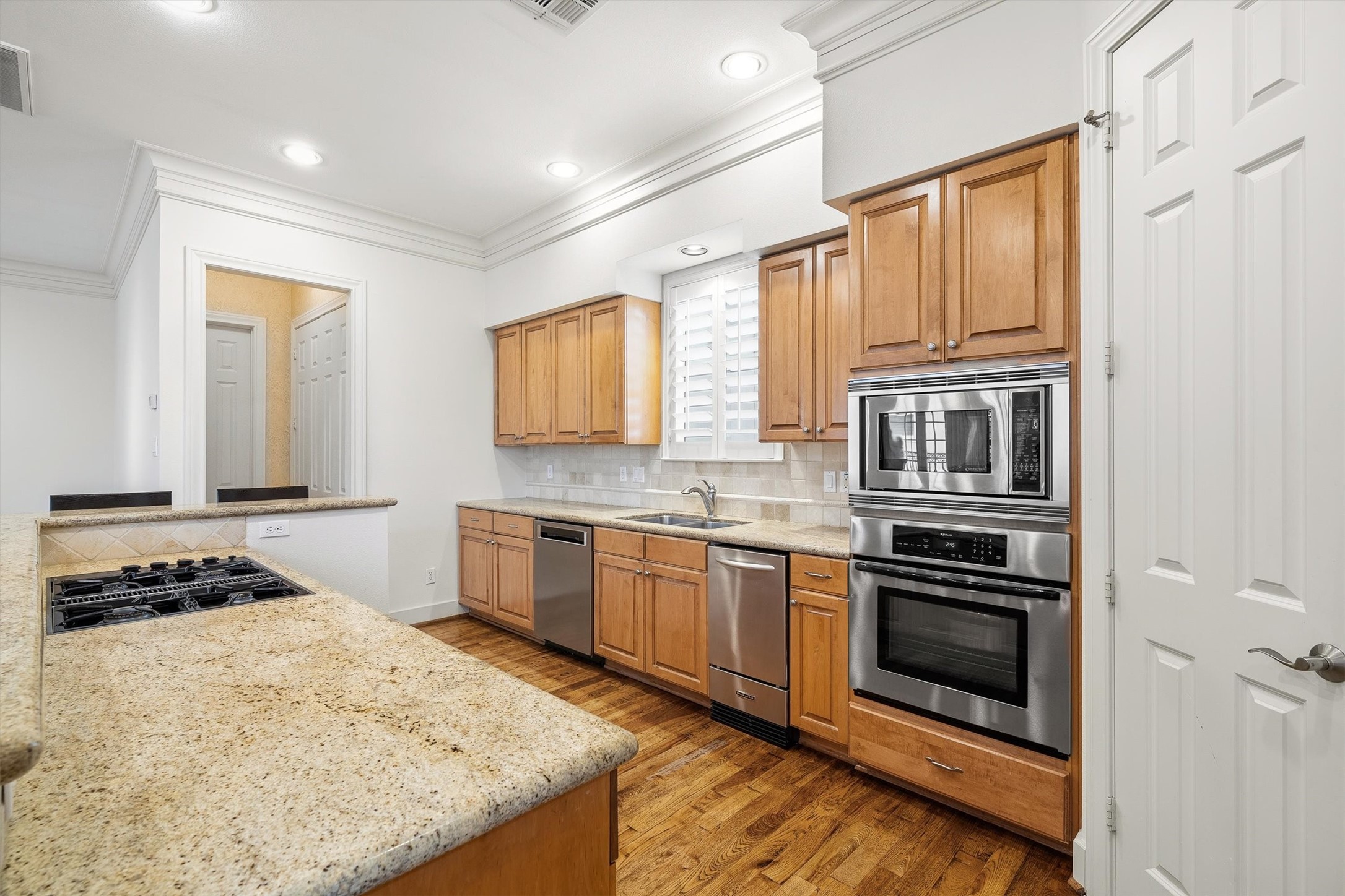 5507 Val Verde Street Houston, TX 77056 - Photo 24 of 42 a kitchen with stainless steel appliances granite countertop a stove and a refrigerator