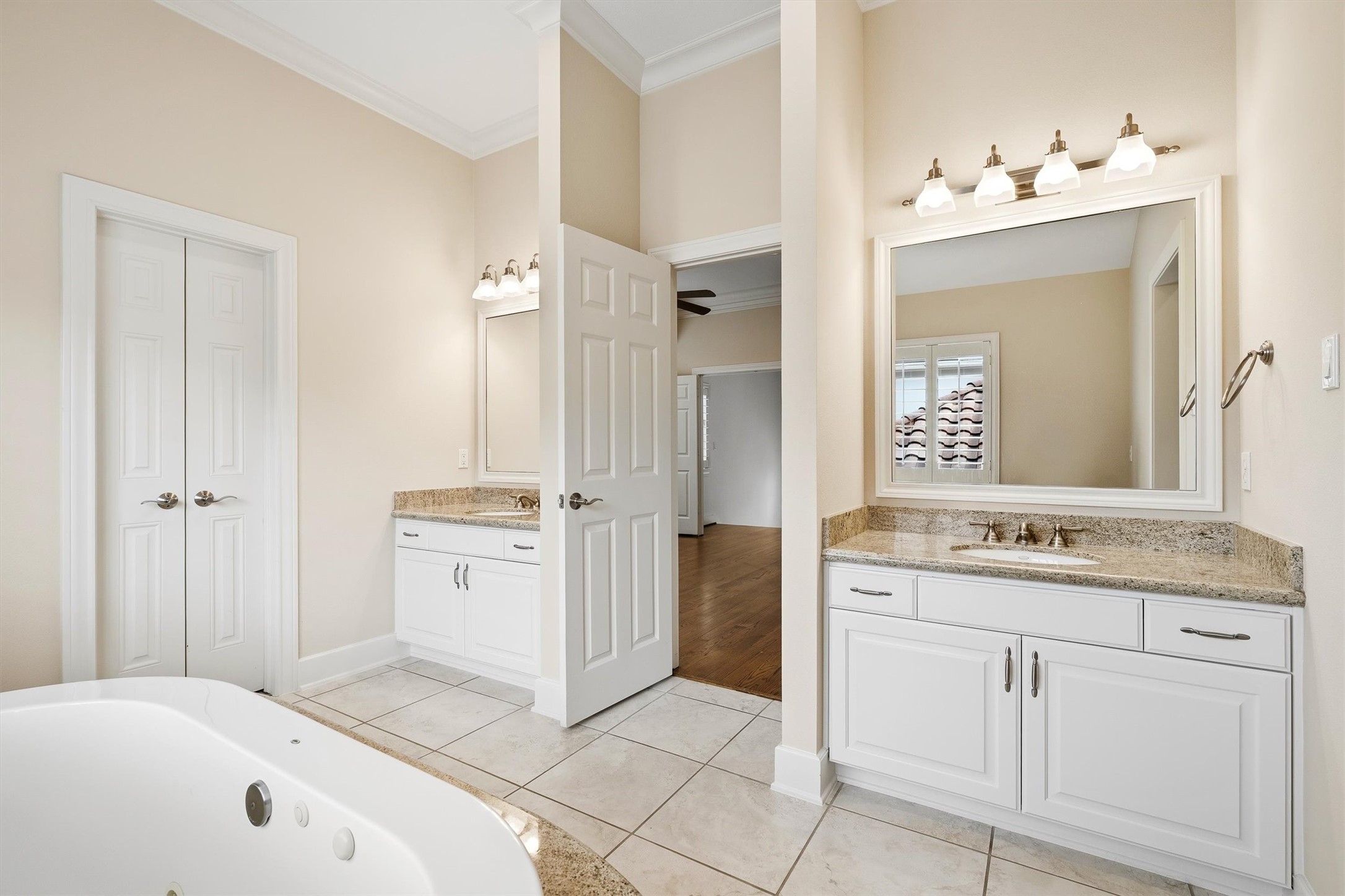 5507 Val Verde Street Houston, TX 77056 - Photo 38 of 42 a spacious bathroom with a granite countertop sink and a mirror