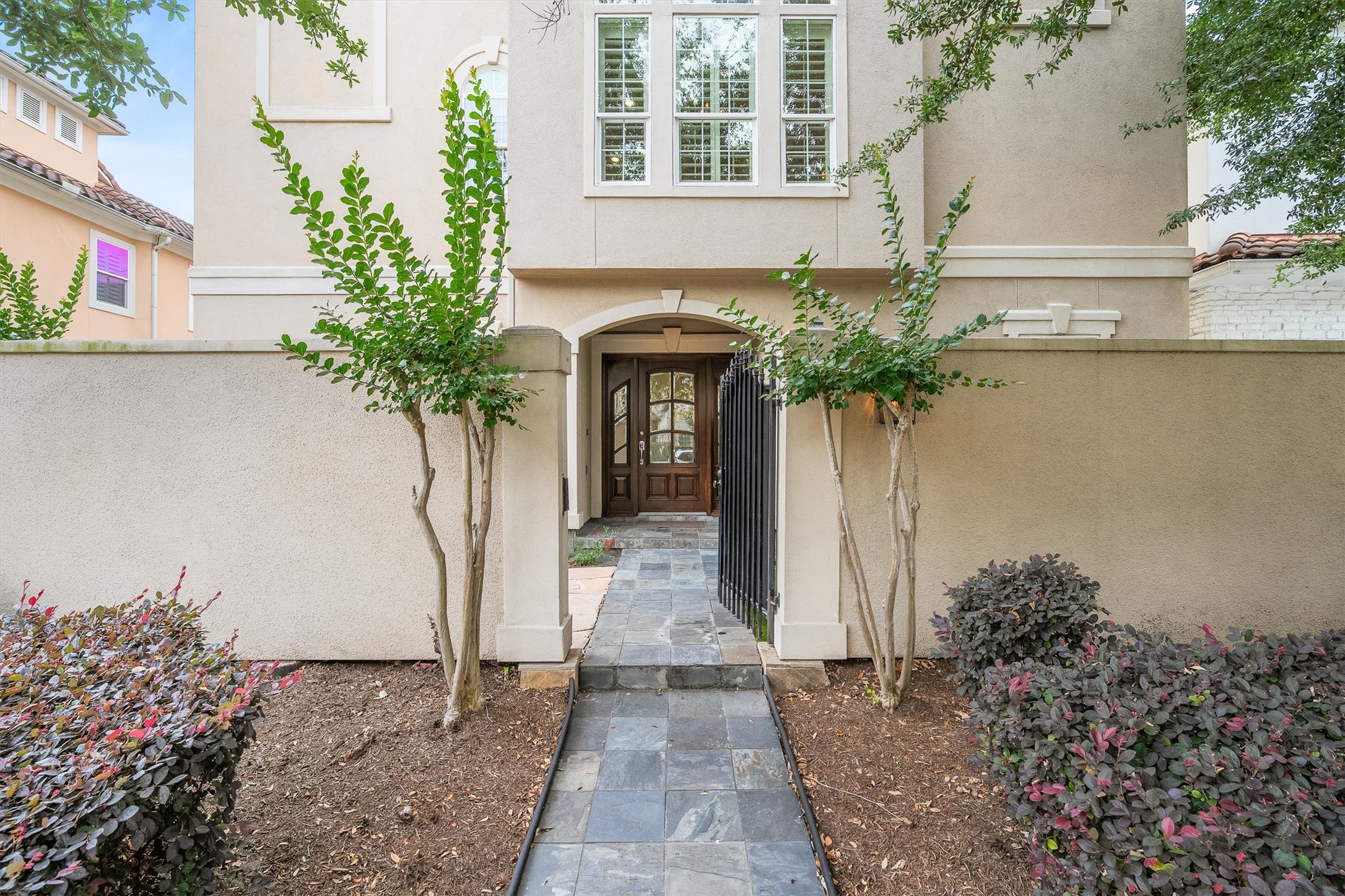 5507 Val Verde Street Houston, TX 77056 - Photo 6 of 42 a front view of a house with a yard and fountain