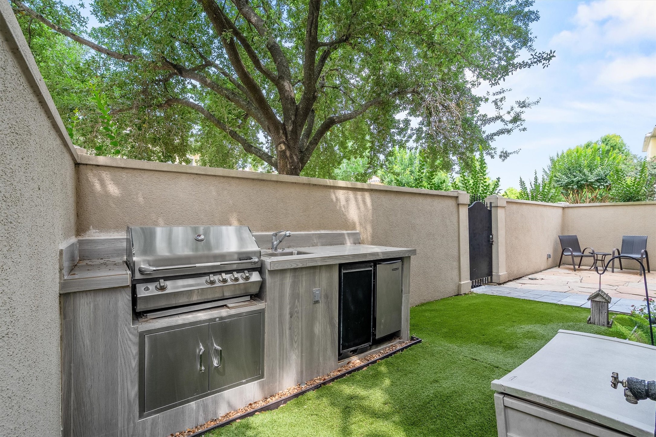 5507 Val Verde Street Houston, TX 77056 - Photo 8 of 42 Outdoor Kitchen area complete with astro turf ground cover for easy clean-up.