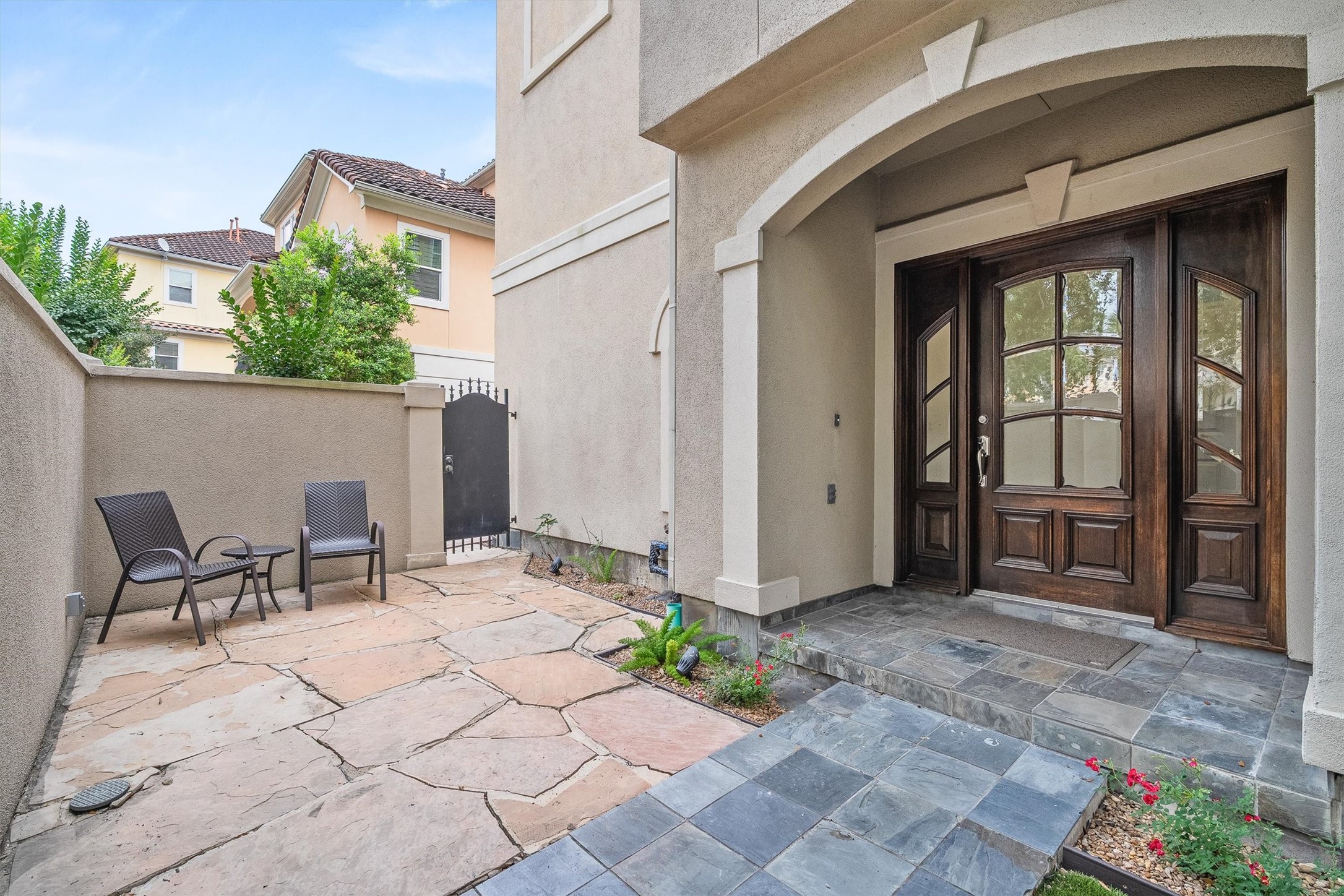 5507 Val Verde Street Houston, TX 77056 - Photo 9 of 42 a view of a patio with table and chairs and potted plants