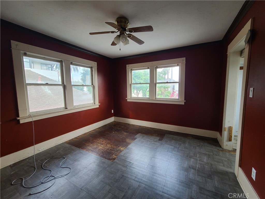 1148 Locust Avenue Long Beach, CA 90813 - Photo 12 of 22 a view of empty room with wooden floor and fan