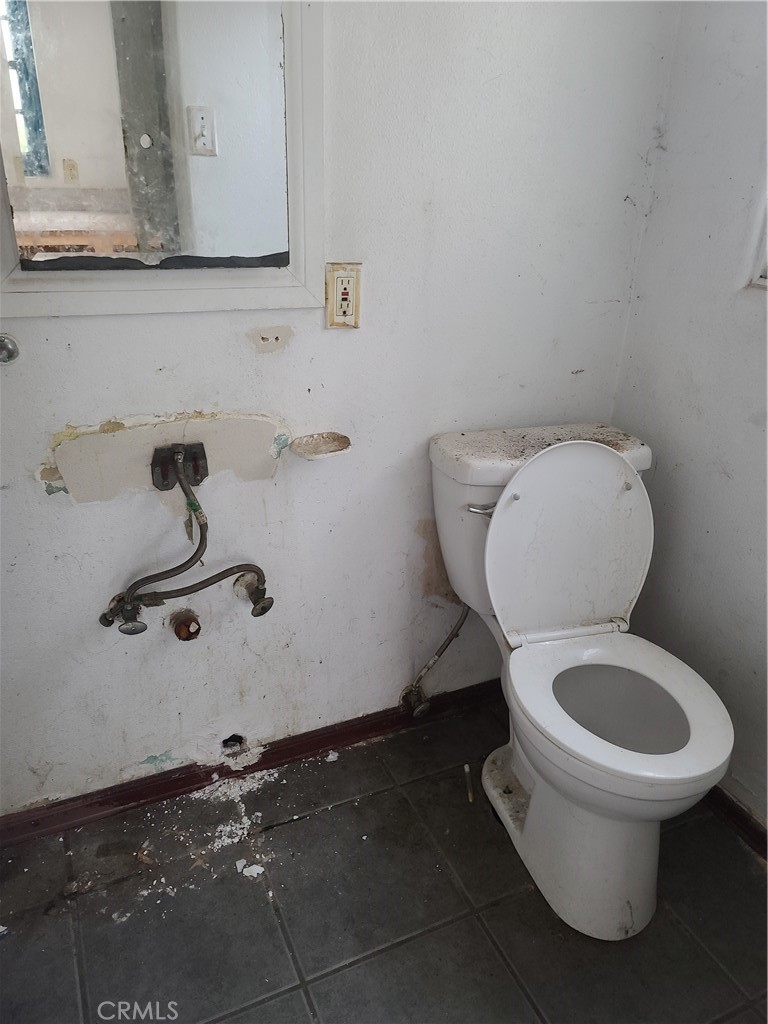 1148 Locust Avenue Long Beach, CA 90813 - Photo 22 of 22 a bathroom with a toilet and a sink