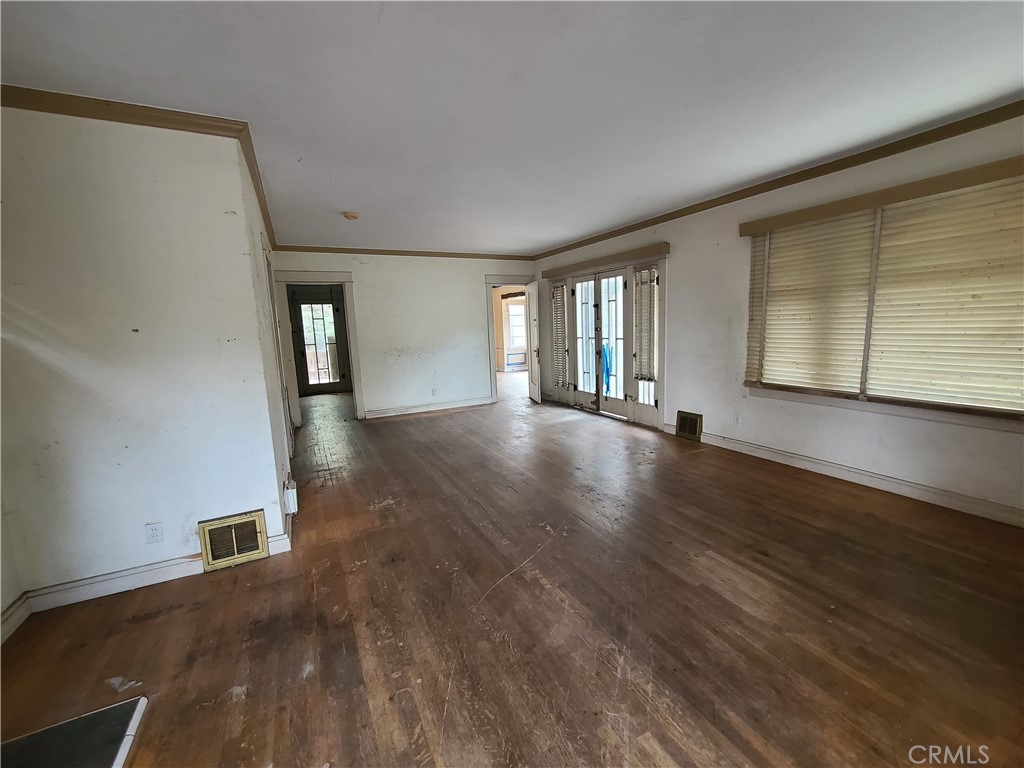 1148 Locust Avenue Long Beach, CA 90813 - Photo 3 of 22 wooden floor in an empty room with a window