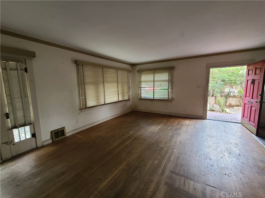 1148 Locust Avenue Long Beach, CA 90813 - Photo 5 of 22 an empty room with wooden floor and windows