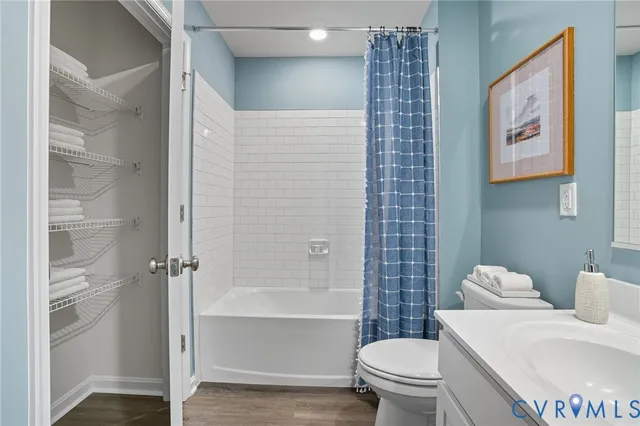 a white toilet sitting next to a bathroom sink