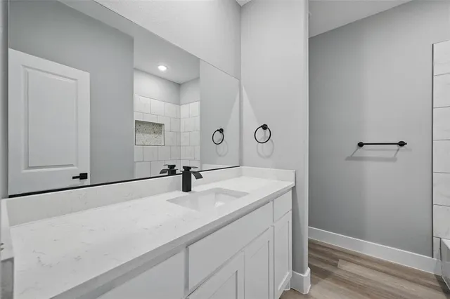a bathroom with a sink and a mirror