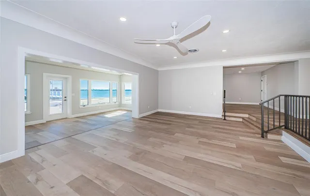 a view of kitchen with kitchen island and stainless steel appliances