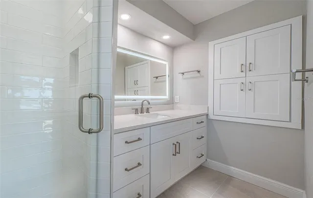 a bathroom with a sink and a mirror