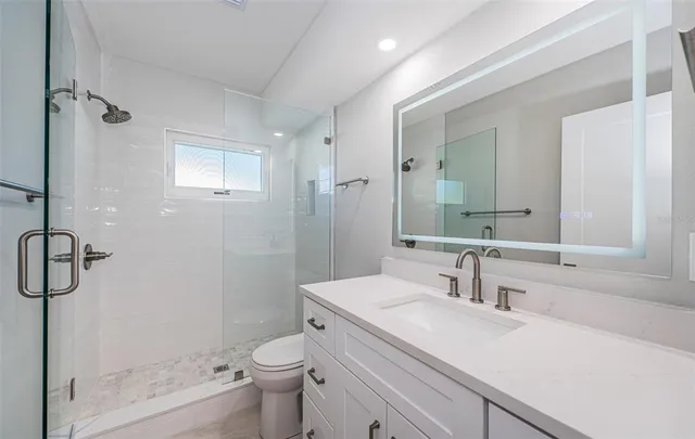 a view of a lake with table and chairs